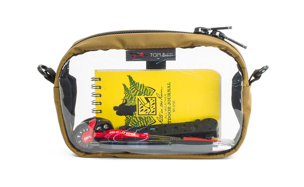 A Coyote light brown 3D Clear Organizer Cube filled with sundries.